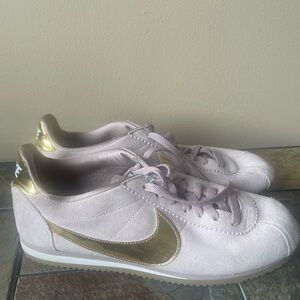 Nike Women's Light Pink Suede Sneakers with Metallic Gold Swoosh